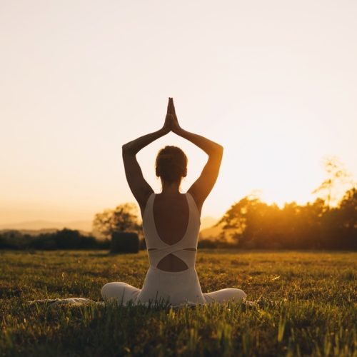 Young,Woman,Practicing,Yoga,On,Nature.,Girl,Meditating,Outdoors.,Female