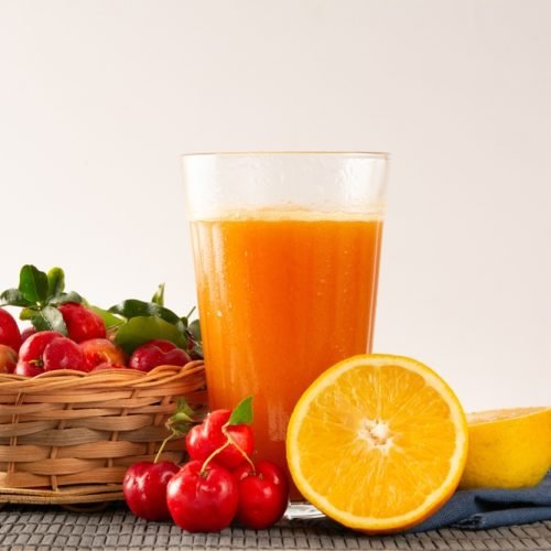 Fresh,Organic,Acerola,And,Orange,Juice,In,A,Glass,Cup